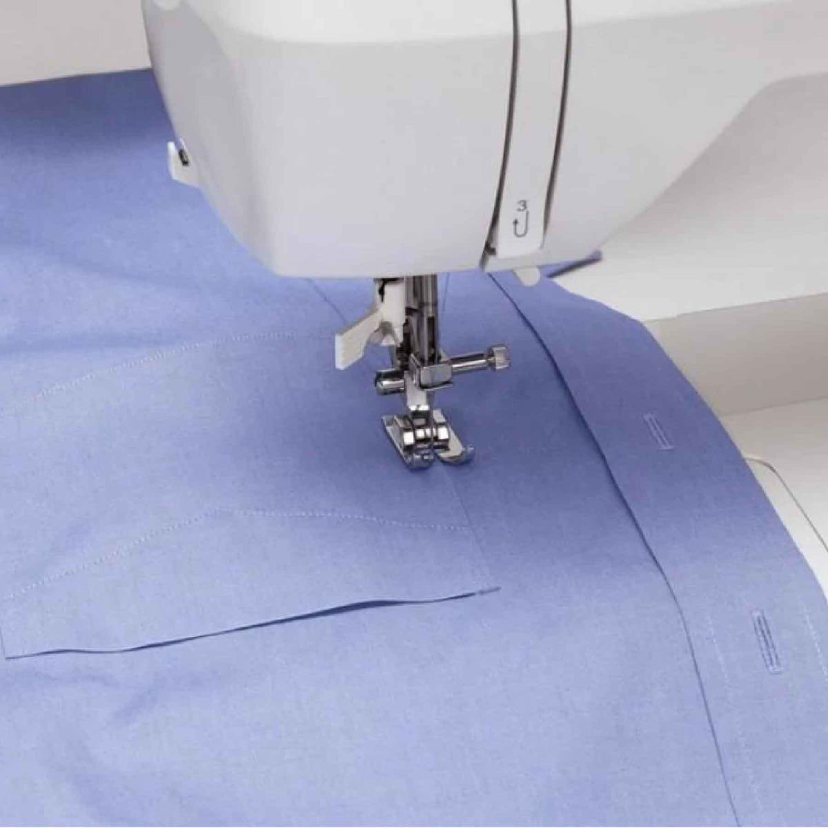 Singer Brilliance 6180 sewing blue shirt fabric with finished buttonholes