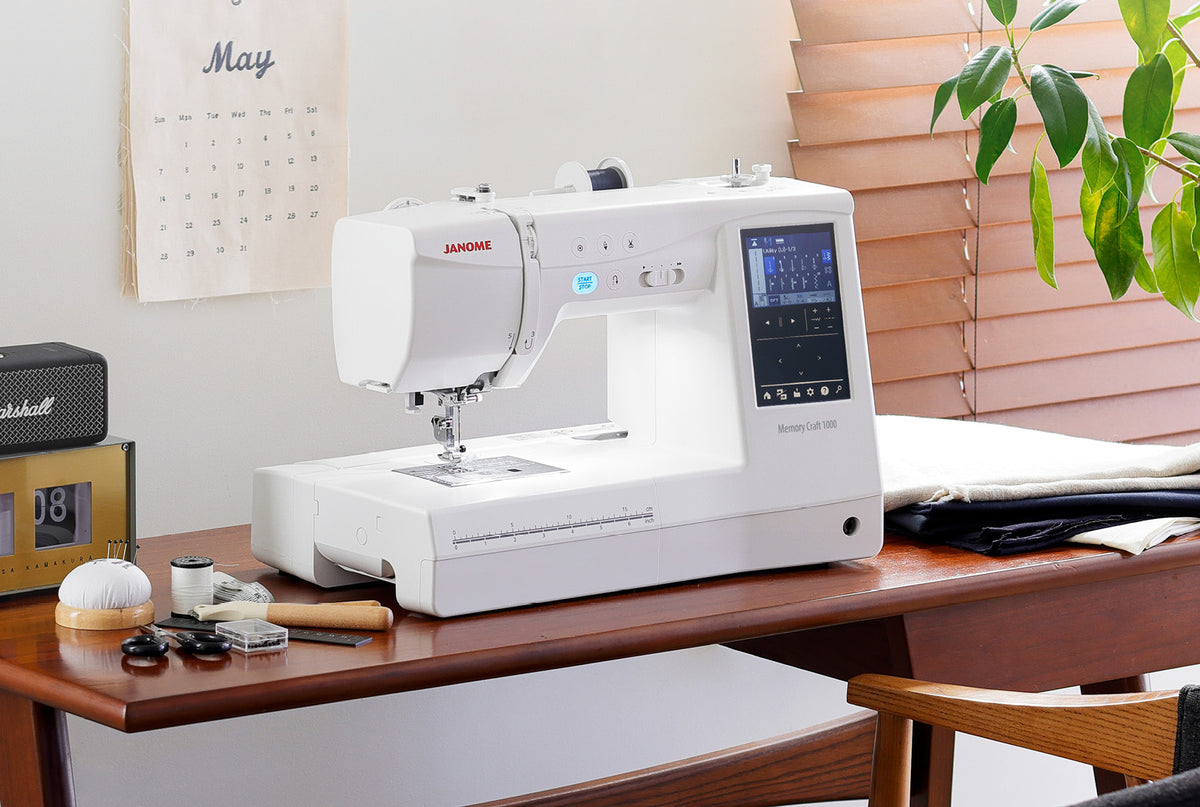 Janome Memory Craft 1000 set up on a sewing table