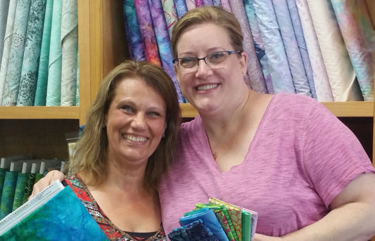 Reva & Robin in Michigan at a local quilt shop on their way to a Quilt Retreat.