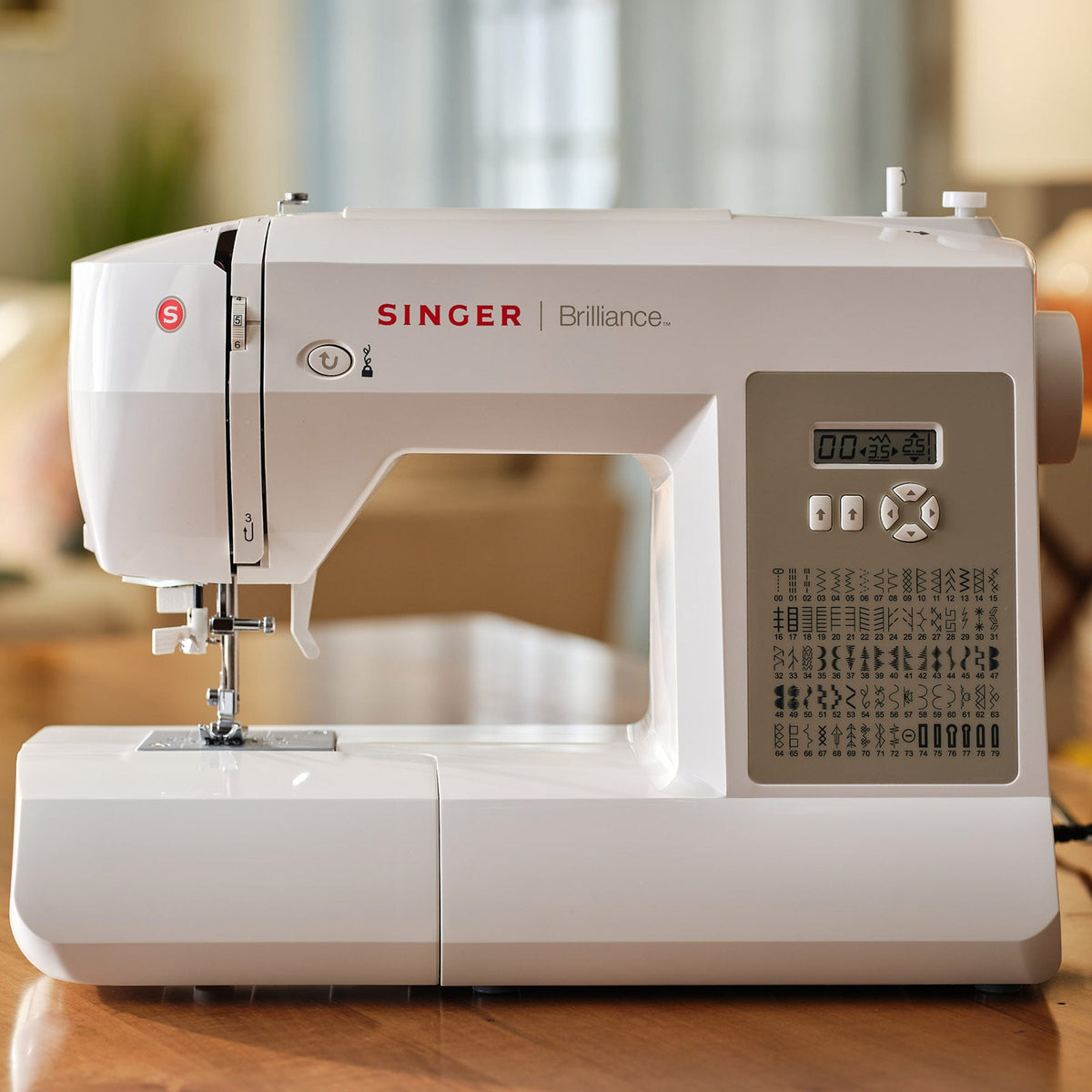 Singer Brilliance 6180 sewing machine with LCD screen and stitch chart