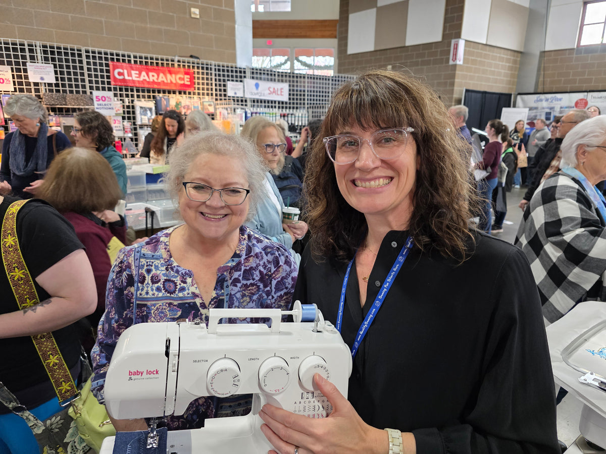 Sewing machine winner at the Quality Sewing booth