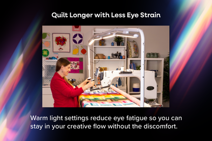 Quilter working at a longarm under the Finesse Aura light bar