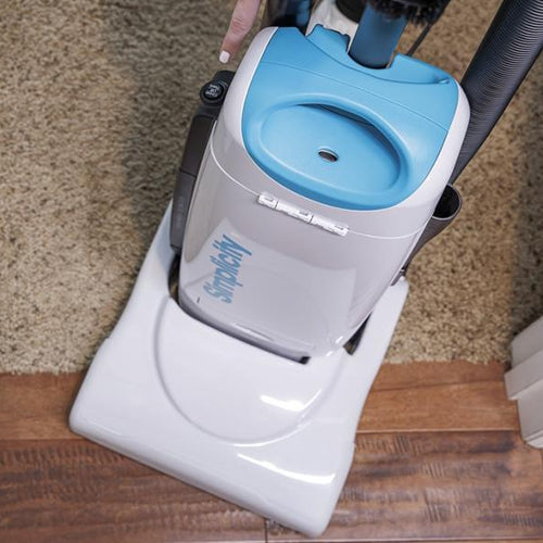 Simplicity S26 self-adjusting nozzle automatically transitioning between carpet and bare floors