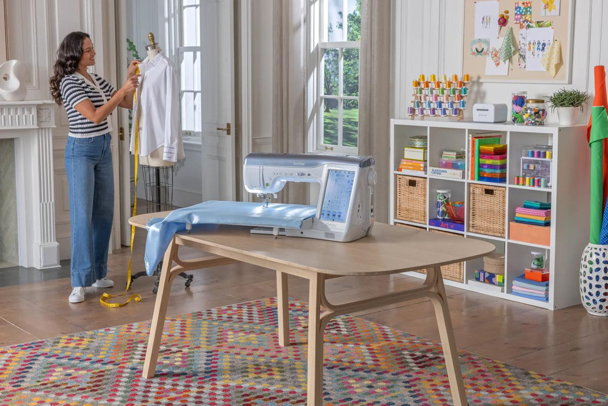 Brother Celeste CX1 sewing and quilting machine in a bright workspace