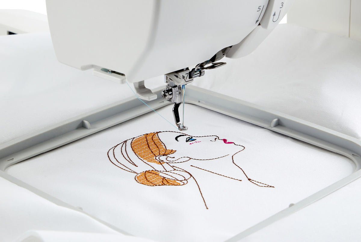 Janome Memory Craft 100E embroidering a design in the hoop