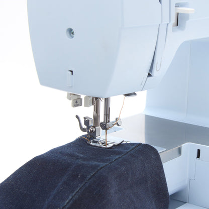Singer Heavy Duty 4423 sewing a denim hem over the stainless steel bed plate