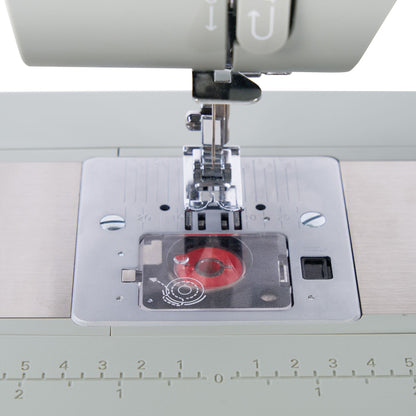 Singer Heavy Duty 4511 Sage needle plate with the bobbin visible under the cover