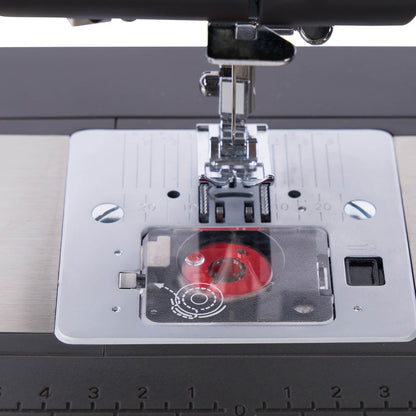 Singer Heavy Duty 4552 Charcoal needle plate with the bobbin visible under the cover