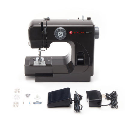 Singer M1000 Black with its bobbins, needles, needle threader, foot switch, and AC adapter