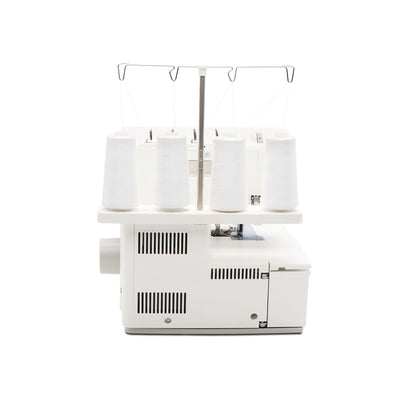 Singer S0600 serger side view with four thread cones on the spool stand