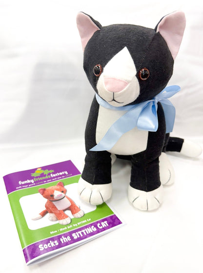 Image of a black and white, sitting cat plush and a Socks the Sitting Cat pattern from funky friends factory.