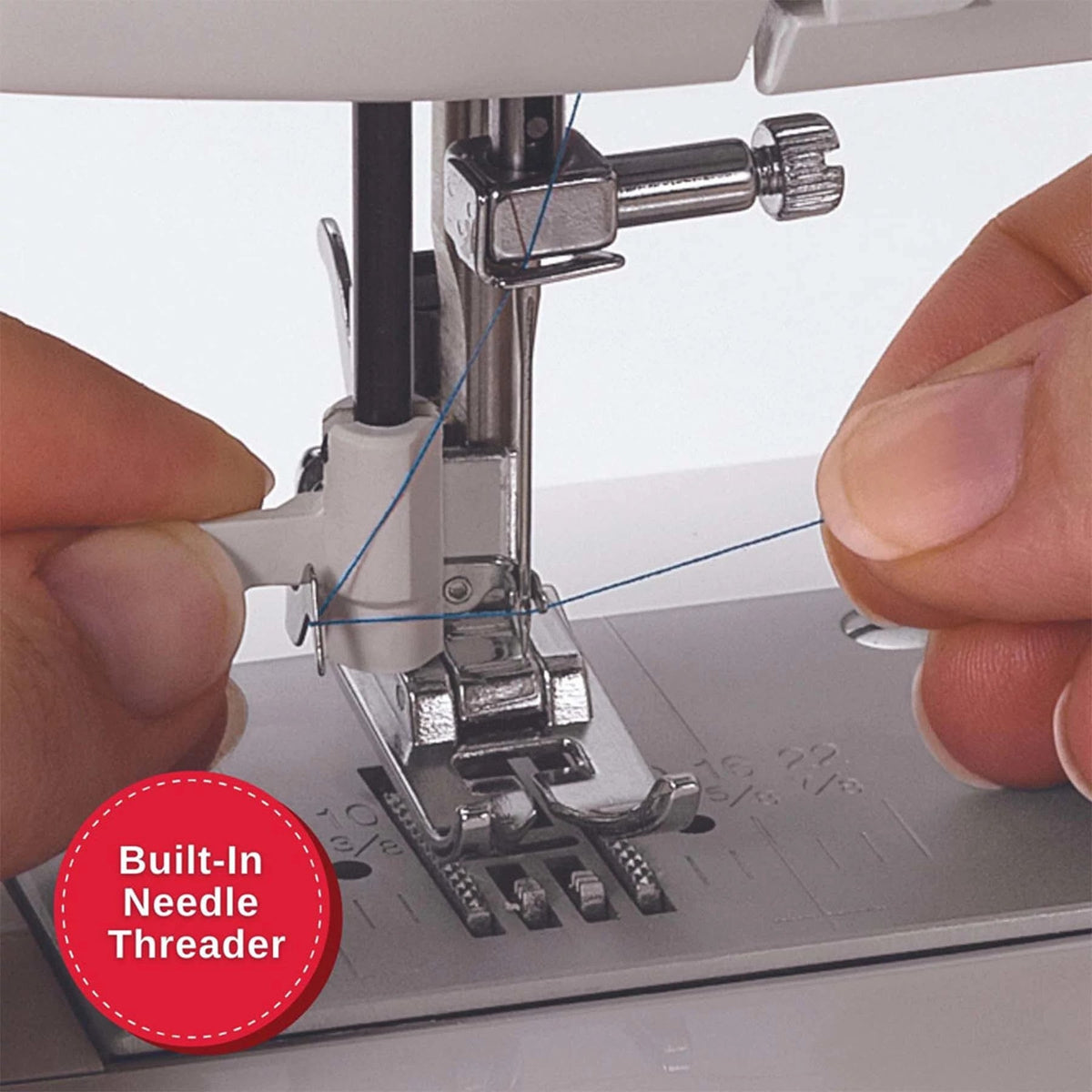 Hands using the built-in needle threader on the Singer MX231