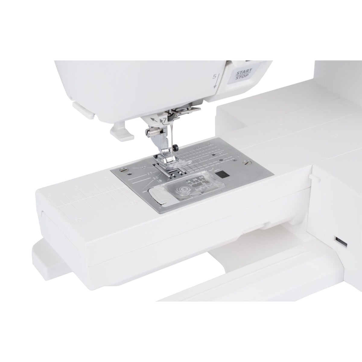 Janome Skyline S3 Anniversary Edition needle plate with the accessory storage box attached